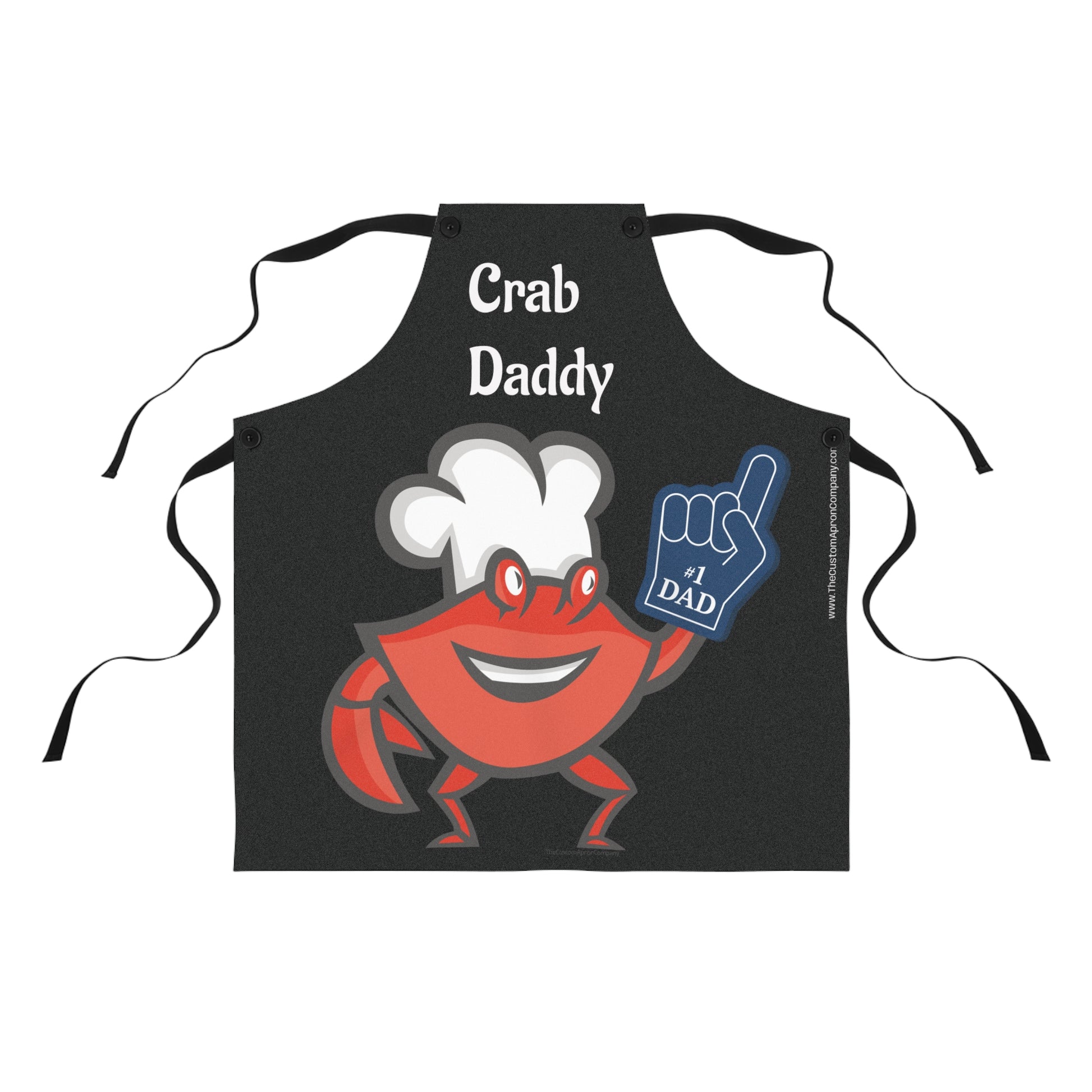 Black apron with a cartoon crab holding a blue card saying '#1 Dad' on a white background